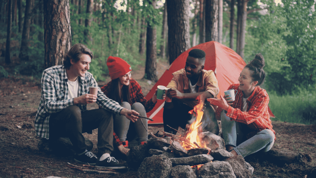 Young campers enjoying time by the campfire. They are also connected to the Wi-Fi network for their convenience and safety.