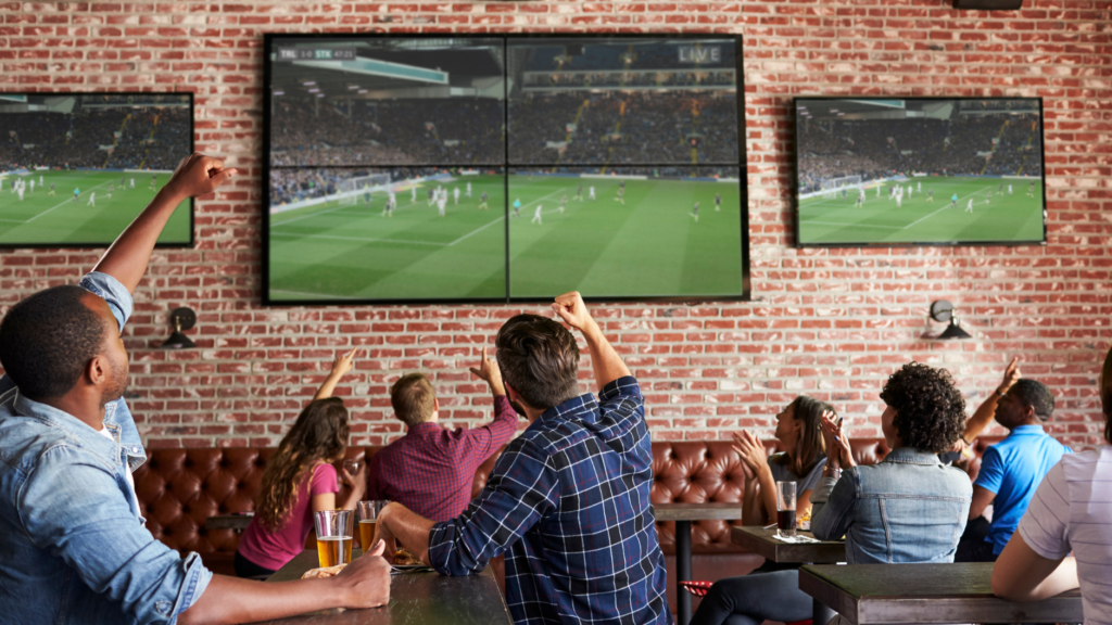 PatronsAtSportsBarWatchingTV