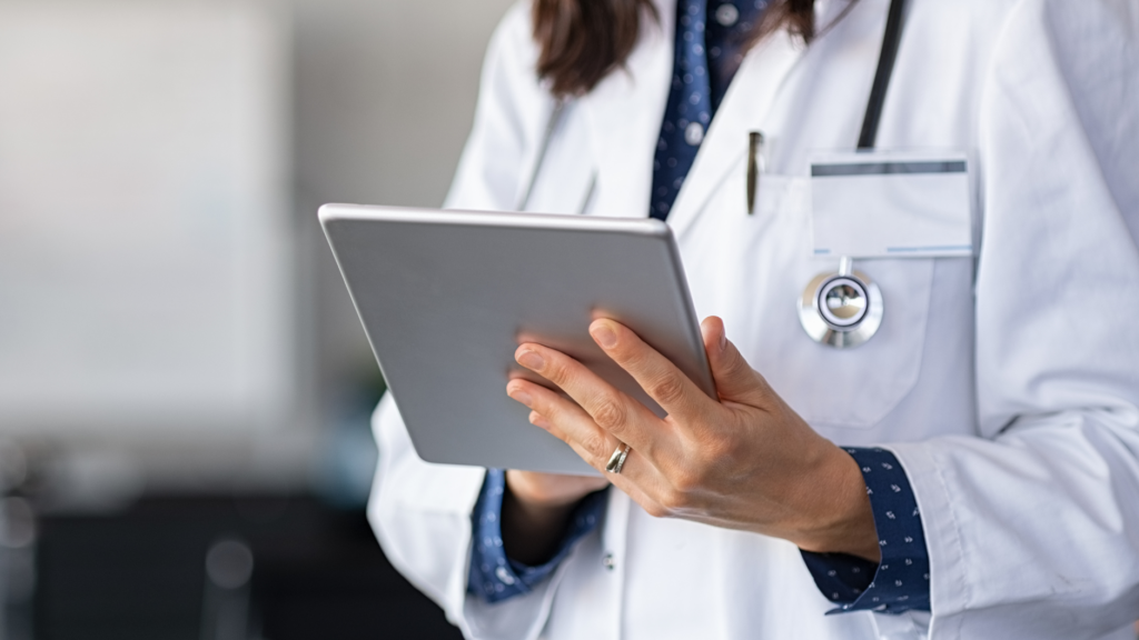 Doctor in Hospital Using Wi-Fi on Tablet