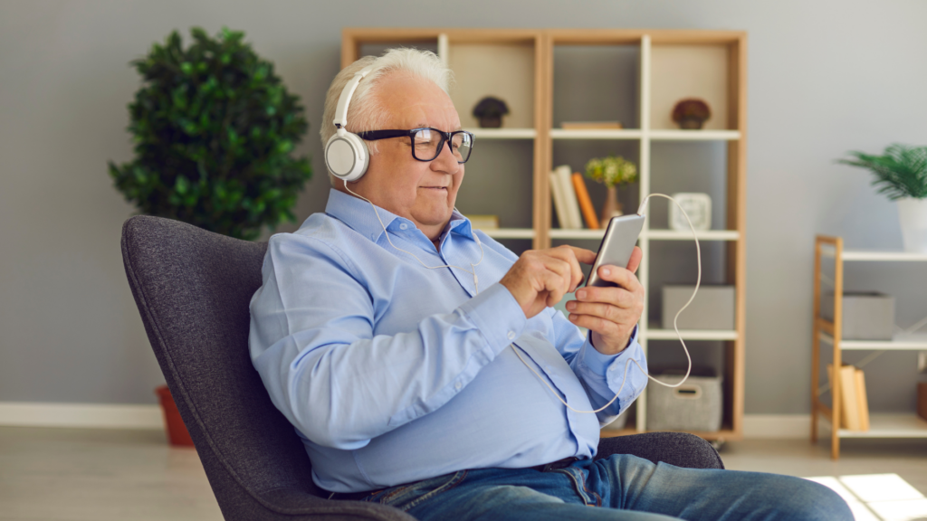 Elderly Gentleman Enjoying Technology