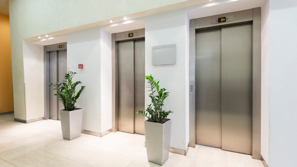 An empty hotel hallway and elevators