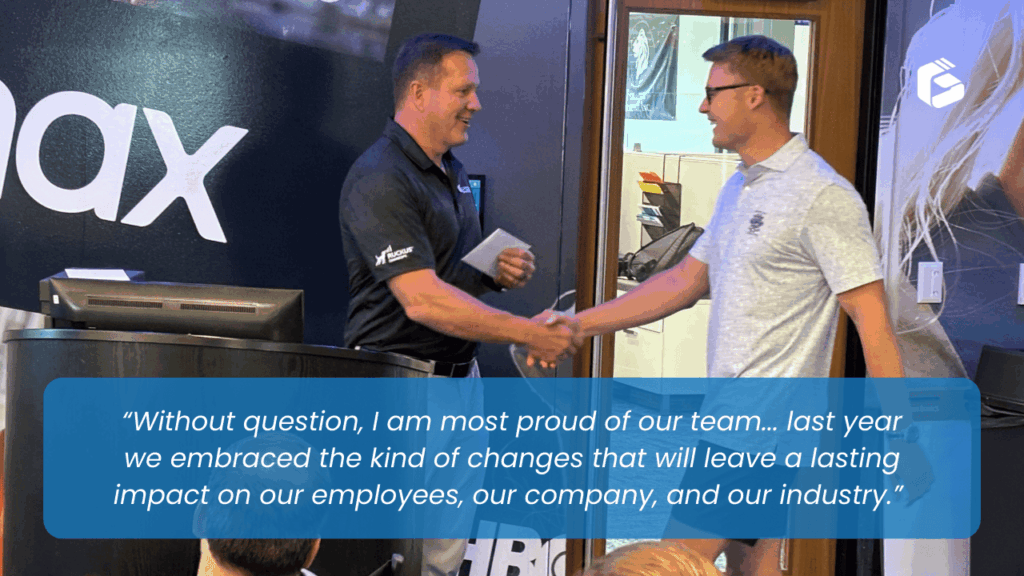 Lance Platt at Groove company meeting handing out awards