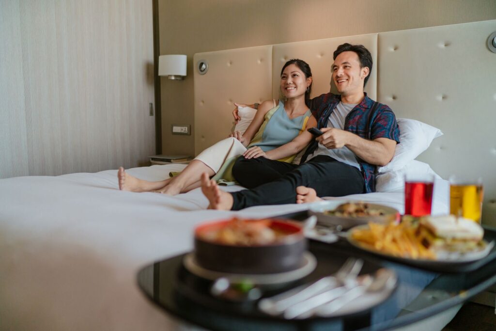 people enjoying in-room entertainment through directv and google