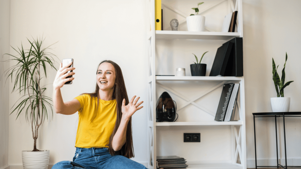 woman in apartment enjoying managed wi-fi while video chatting