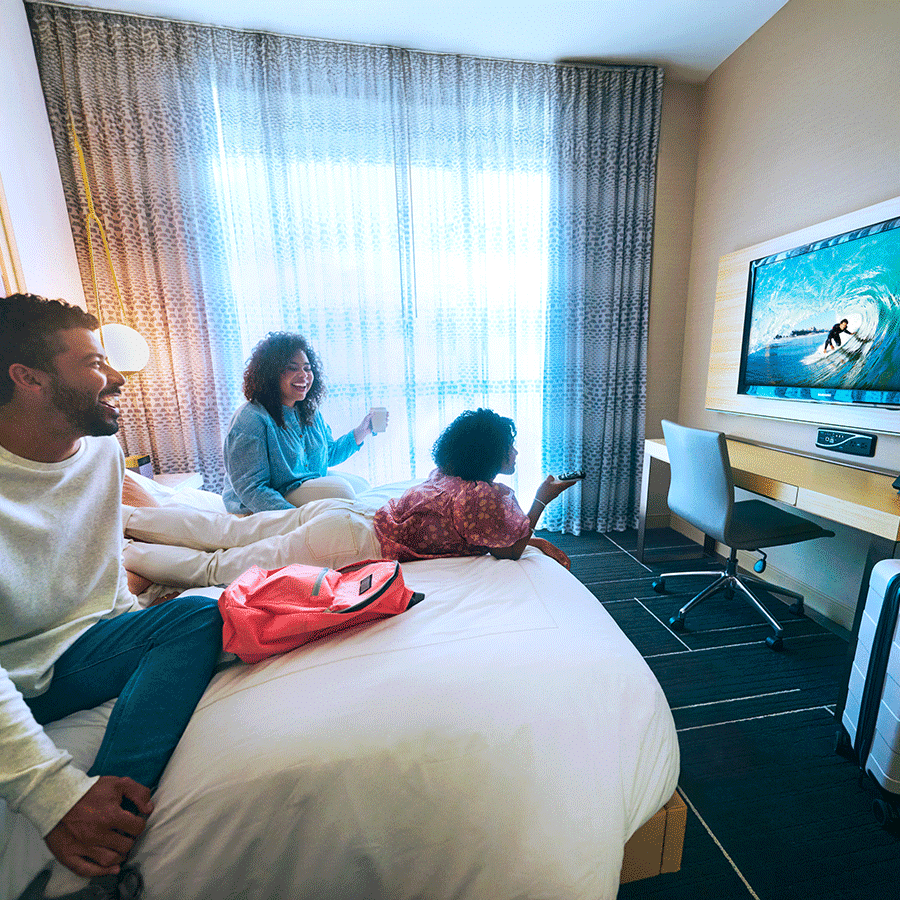 Family Enjoying TV in Hotel