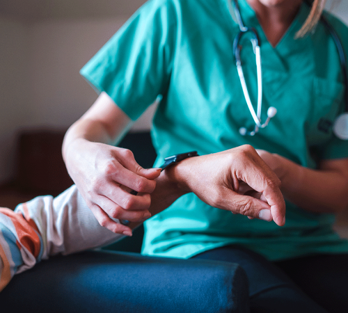 Healthcare professional monitoring patient