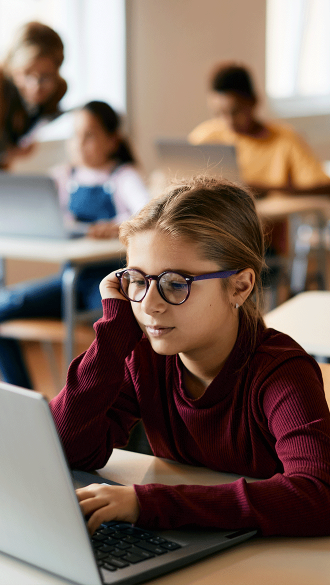 Student on laptop in School