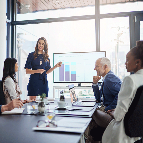 Woman in Boardroom Using TV Display