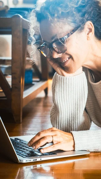 Woman Working on Laptop Connected to Internet