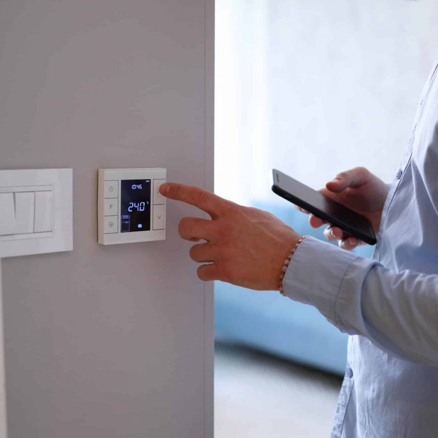 Man using smart technology at his apartment