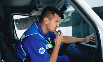 First responder on radio communicating with ERCES DAS in commercial building