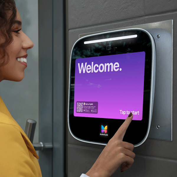 Woman gaining access through video entry system