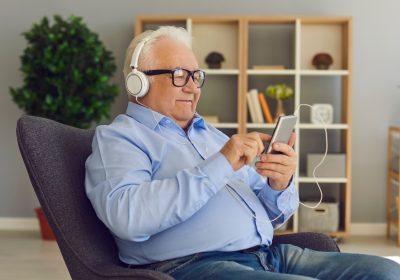 Elderly Gentleman Enjoying Technology