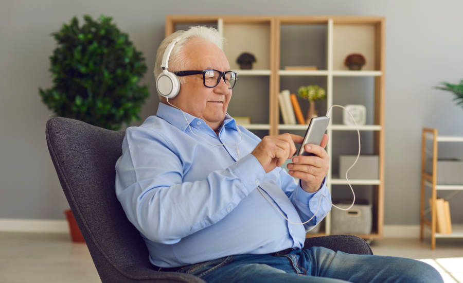 Elderly Gentleman Enjoying Technology