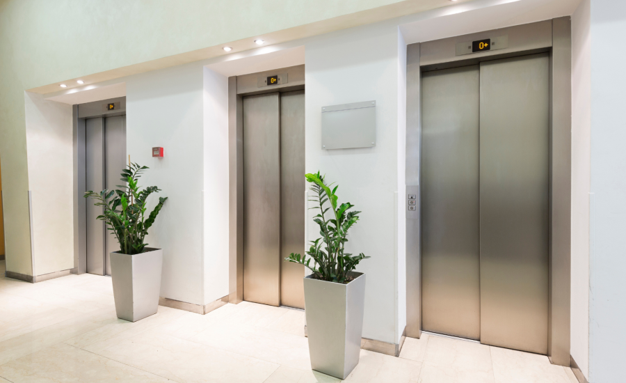 An empty hotel hallway and elevators