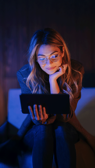 Woman Watching Tablet At her Condo