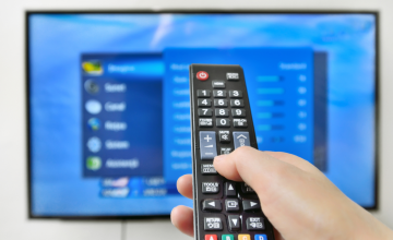 PersonChangingTVChannel