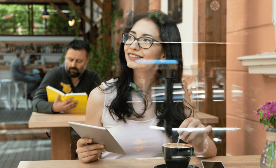 Woman enjoying technology & coffee at hotel