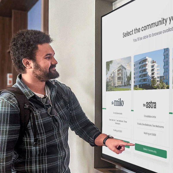 Man using self-guided tour to search apartment layouts