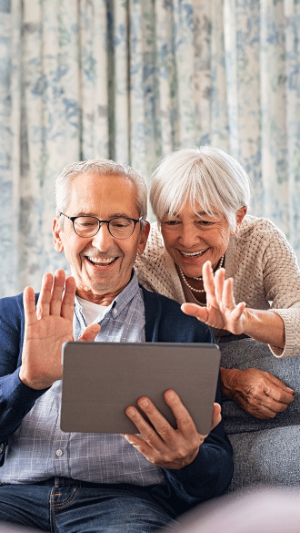 Senior living couple on video call on tablet