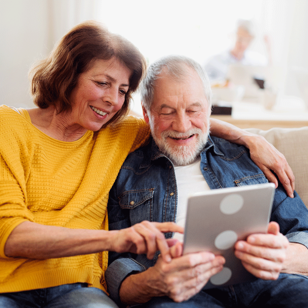 woman-helping-man-tablet-2